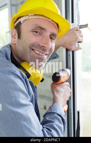 happy builder man smiling at the camera Stock Photo