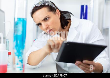 young scientist works in modern biological lab Stock Photo