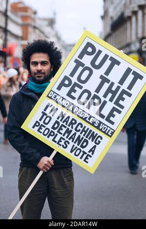 LONDON, UK - A anti-brexit protester holds a placard during Anti Brexit protest on March 23, 2019 in London. Stock Photo