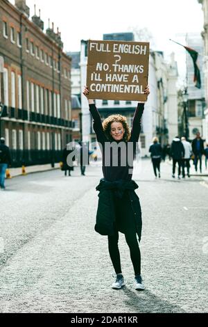 LONDON, UK - A anti-brexit protester holds a placard during Anti Brexit protest on March 23, 2019 in London.