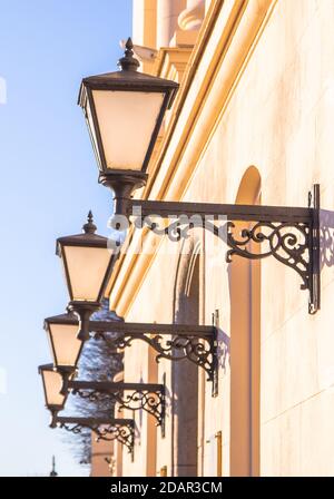 plafonds of city lamps on the wall of the house Stock Photo