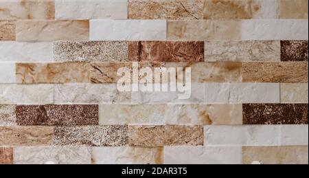 Natural facade stone decoration quartzite background texture. modern granite stone wall Stock Photo