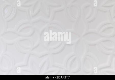 white wall background with various forms of ornamentation Stock Photo