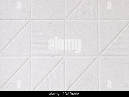 white wall background with various forms of ornamentation Stock Photo