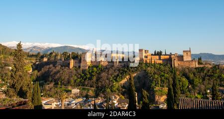Alhambra on the Sabikah hill, Moorish citadel, Nasrid palaces, Palace of Charles the Fifth, behind Sierra Nevada with snow, Granada, Andalucia, Spain Stock Photo