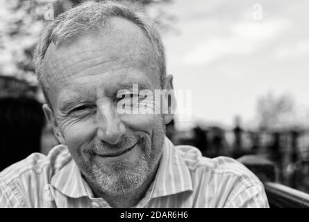 Portrait of a happy middle aged man with stubble Stock Photo