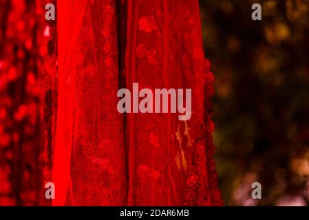 Red sequins pattern. Sparkling sequins background. Red sequin fabric for background. rectangular red shiny fabric with sequins, Christmas background. Stock Photo