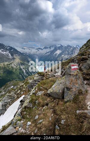 Hiking on the Berlin High Altitude Trail, Schlegeis Reservoir, Schlegeis reservoir, Zillertal Alps, Schlegeiskees Glacier, Zillertal, Tyrol, Austria Stock Photo