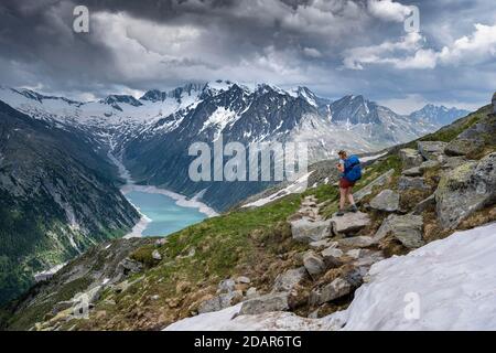 Hiking on the Berlin High Altitude Trail, Schlegeis Reservoir, Schlegeis reservoir, Zillertal Alps, Schlegeiskees Glacier, Zillertal, Tyrol, Austria Stock Photo