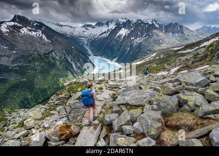 Hiking on the Berlin High Altitude Trail, Schlegeis Reservoir, Schlegeis reservoir, Zillertal Alps, Schlegeiskees Glacier, Zillertal, Tyrol, Austria Stock Photo