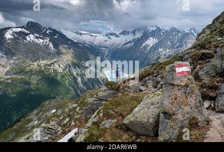 Hiking on the Berlin High Altitude Trail, Schlegeis Reservoir, Schlegeis reservoir, Zillertal Alps, Schlegeiskees Glacier, Zillertal, Tyrol, Austria Stock Photo