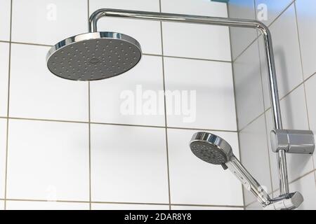 https://l450v.alamy.com/450v/2dar8y8/shower-head-on-white-tile-background-2dar8y8.jpg