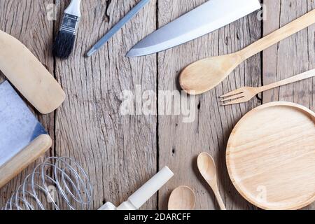 Set of wooden spoon,fork,knife, on old wooden table background,top view copy space for your product and cooking design Stock Photo