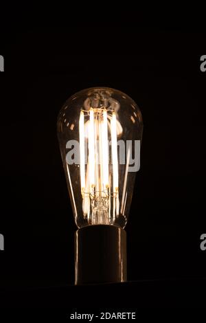 Modern LED light bulb cimilar to vintage fillament lamp Stock Photo
