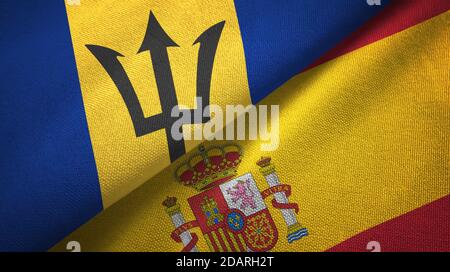 Barbados and Spain two flags textile cloth, fabric texture Stock Photo