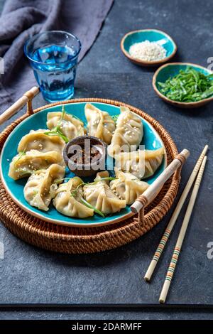 Asian Potstickers dumplings Gyoza with Soy Sauce Stock Photo