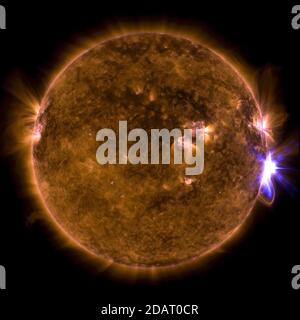 THE SUN - 10 September 2017 - NASA's Solar Dynamics Observatory captured this image of a solar flare – as seen in the bright flash on the right side – Stock Photo