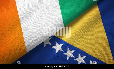 Cote d'Ivoire and Bosnia and Herzegovina two flags textile cloth, fabric texture Stock Photo