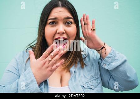 Young woman with shocked expression. Stock Photo