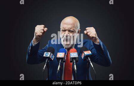 Cheerful politician giving a speech during the election campaign Stock Photo