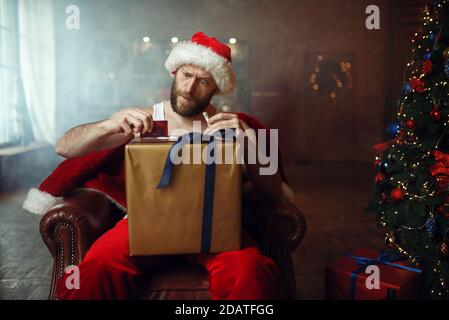 Bad Santa claus takes drugs, cocaine party, humor Stock Photo