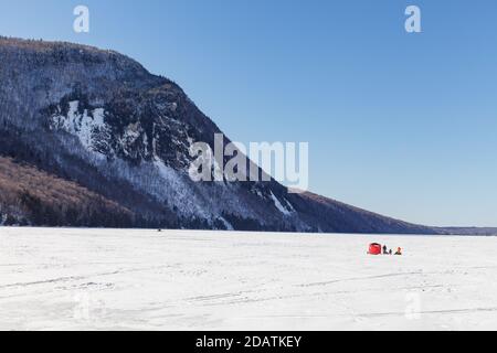 Lake Willoughby covered with ice and snow at winter. Sunny day. Stock Photo