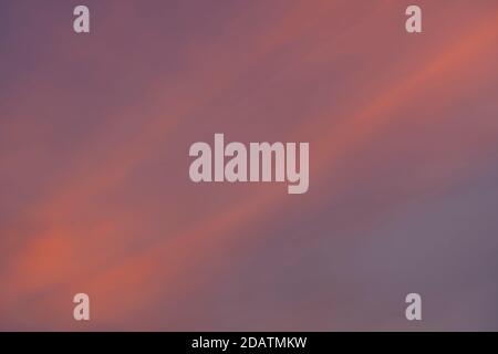 Cloud in the sky at sunset texture background. Red, orange and blue abstract shades. True high resolution photography Stock Photo