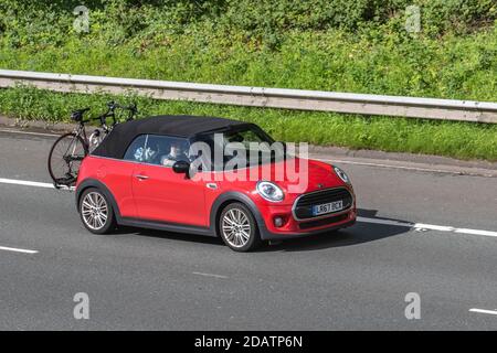 2017 Red Mini Cooper Auto; Vehicular traffic, moving vehicles, cars, vehicle driving on UK roads, motors, motoring on the M6 motorway highway UK road network. Stock Photo