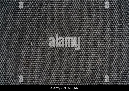The texture of a dense gray woolen fabric. Close-up textile background. Stock Photo