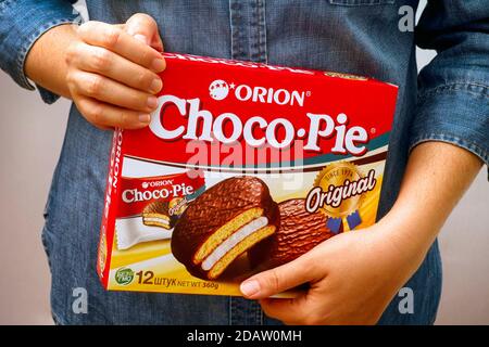 Tambov, Russian Federation - October 30, 2020 Orion Choco-Pie box in woman hands. Stock Photo