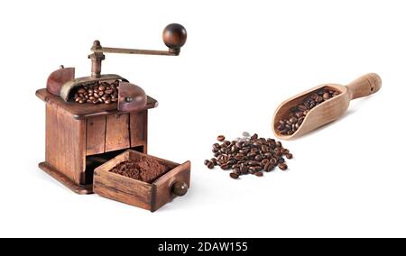 Coffee beans with wooden coffee grinder and wooden spoon, on white background, with shadows. Stock Photo