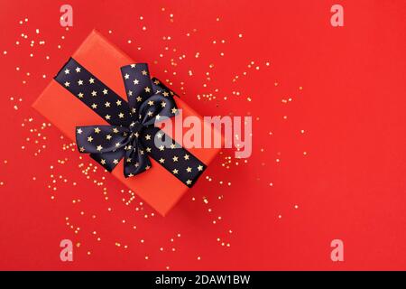 Christmas gift box on red background top view Stock Photo