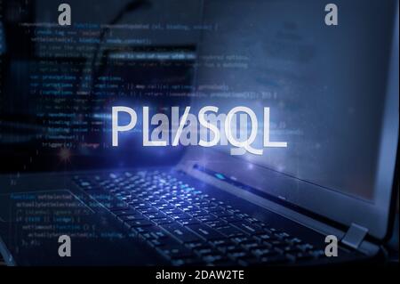 PL/SQL inscription against laptop and code background. Learn pl/sql programming language, computer courses, training. Stock Photo