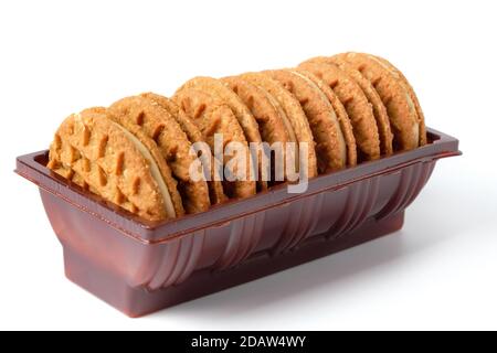 Pack of peanut butter cream cookies isolated on white Stock Photo