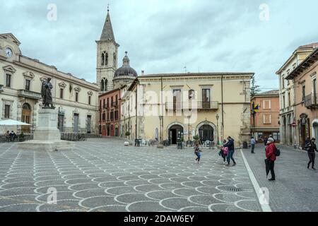 SULMONA, ITALY - september 27 2020: cityscape with people strolling on Sunday morning in central XX Settembre square at historical town, shot in brigh Stock Photo