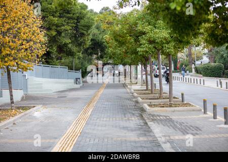 Athens, Greece. November 12, 2020. COVID19 coronavirus lockdown. Empty street in Halandri city center, north Athens suburb. Stock Photo