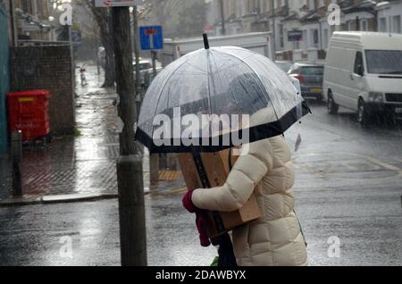 London, UK, 15 November 2020 Heavy rain at Clapham Junnction, Battersea. Credit: JOHNNY ARMSTEAD/Alamy Live News Stock Photo