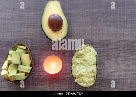 Different avocados fruit in a raw isolated on grey background. Green avocados, minimal flat lay style. Stock Photo