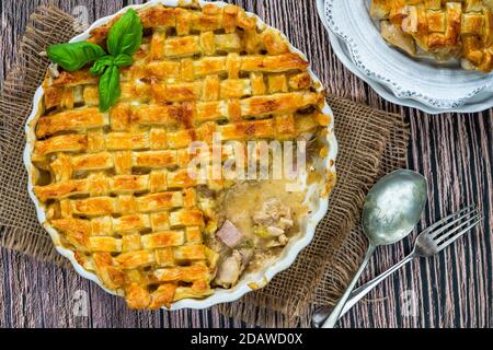 Chicken and bacon pie with lattice puff pastry - overhead view Stock Photo