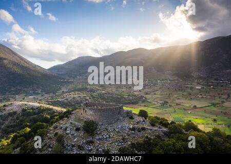 Aerial view of the ruins of a hilltop Turkish fortress on the Askifou Plateau at sunset, Crete, Greece Stock Photo