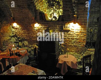 Situated in brick cellars of an Old Town tenement house, Cyrano, recognised by the Michelin Guide is one of Kraków's finest restaurants Stock Photo