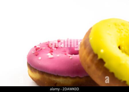 Series of photos of beautiful tasty multicolored donuts with glaze on white isolated background Stock Photo