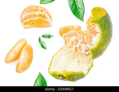 Peeled Tangerines with green leaves and slices isolated on white background. Mandarines, clementine Pattern. Top view. Flat lay Stock Photo