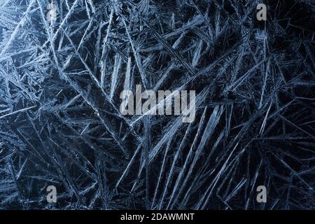 White freeze, ice crystal texture on black background. Stock Photo