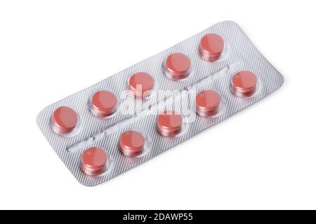 Blister package with red pills isolated on white background Stock Photo