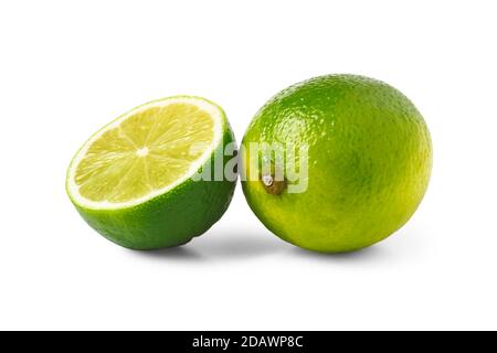 Sliced and whole lime fruit isolated on white background Stock Photo