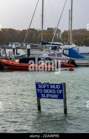 a sig partly submerged saying that there is soft med to the sides of the slipway at yarmouth on the isle of wight. Stock Photo
