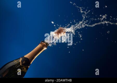 Celebration theme with splashing champagne Stock Photo