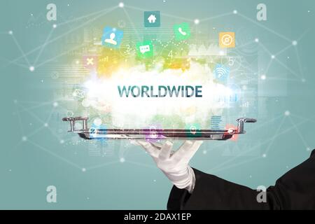 Waiter serving social networking concept with WORLDWIDE inscription Stock Photo