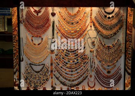 Shop window display of traditional Baltic coast amber jewellery on sale in the Old Town. Stock Photo